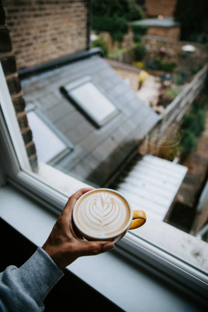 istock Man holding oat latte art POV 1400486113