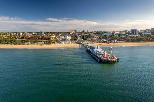 The drone aerial view of the Bournemouth beach, Observation Wheel and Pier. Bournemouth is a coastal resort town in the Bournemouth, Christchurch and Poole council area of Dorset, England. bournemouth stock pictures, royalty-free photos & images