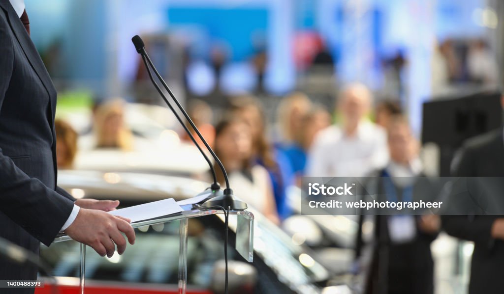 Politician speaking publicly from the lectern Politician speaking publicly from the lectern during political rally, Nikon Z7 Press Conference Stock Photo