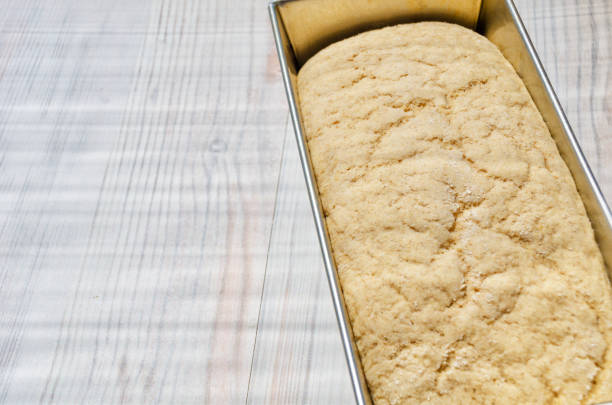 Yeast bread in the form of a kerpicik before baking on the table.