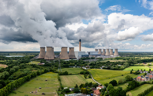 Aerial landscape view of Drax Power Station in North Yorkshire with smoking chimneys and cooling towers pumping CO2 into the atmosphere