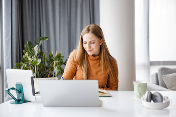 istock Woman multi-tasking in home office 1400490119