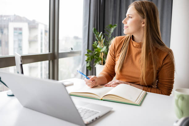 istock Young woman working in the office 1400490297