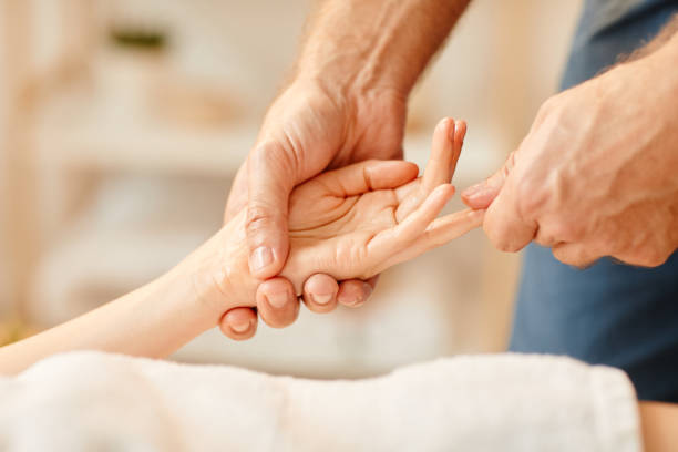 istock Hand Massage in SPA Close up 1400491950
