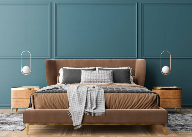 istock Empty blue wall in modern and cozy bedroom. Mock up interior in contemporary style. Free space, copy space for your picture, text, or another design. Bed, lamps. 3D rendering. 1400492004