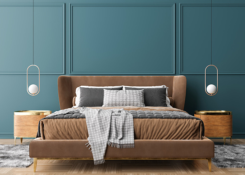 Empty blue wall in modern and cozy bedroom. Mock up interior in contemporary style. Free space, copy space for your picture, text, or another design. Bed, lamps. 3D rendering