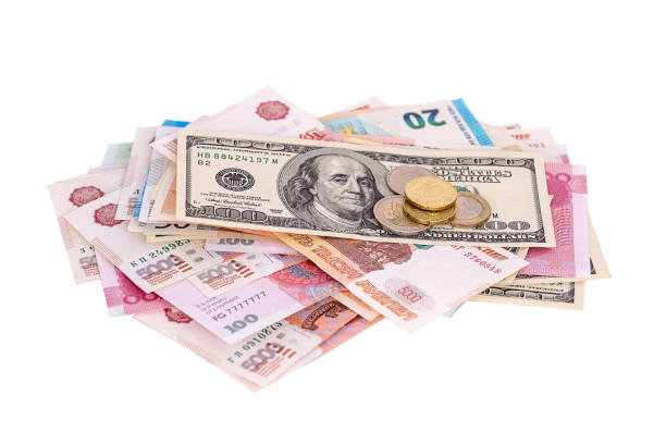 istock A bundle of money from different countries isolated on a white background 1400495226