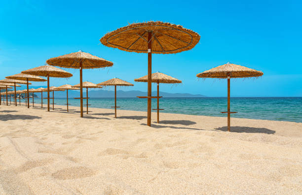 istock empty beach with wooden sun umbrellas on the mediterranean sea 1400495528