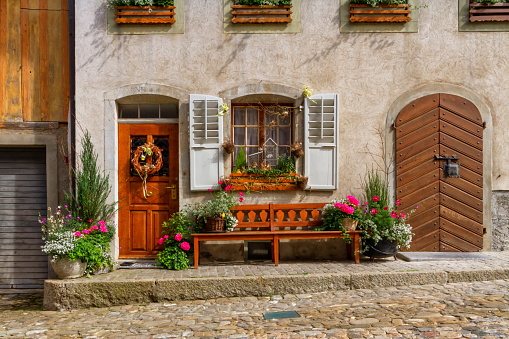 Close up on houses in Gruyere village in Fribourg canton by beautiful day, Switzerland