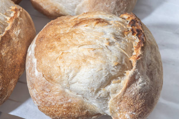 istock Traditional Italian bread on a shelf with natural light,handmade bread 1400497666