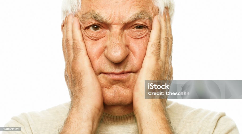 lifestyle, health and old people concept: Portrait of an old man having a toothache against white background lifestyle, health and old people concept: Portrait of an old man having a toothache against white background, close up Distraught Stock Photo