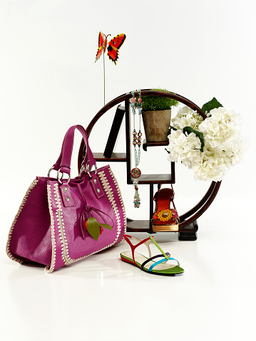 Still life of woman accessories on white background
