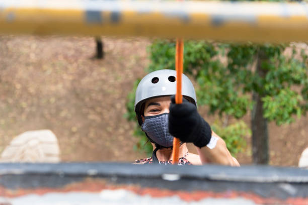 Salvador, Bahia, Brazil - October 24, 2021: Female rappelist going down the rappel walkway. City of Salvador capital of Bahia, Brazil.
