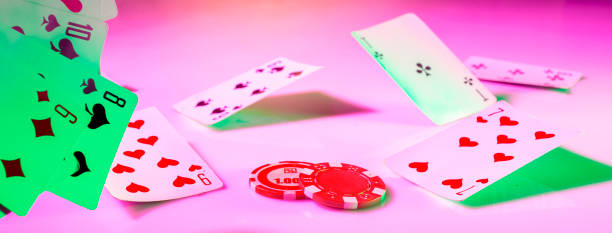 istock poker chip among flying playing cards on bright colored backgrounds macro with empty space for name, text, inscriptions 1400504150