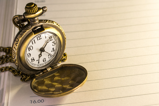 pocket watch ,selective focus . Focus area are the dial of the clock,picture style 