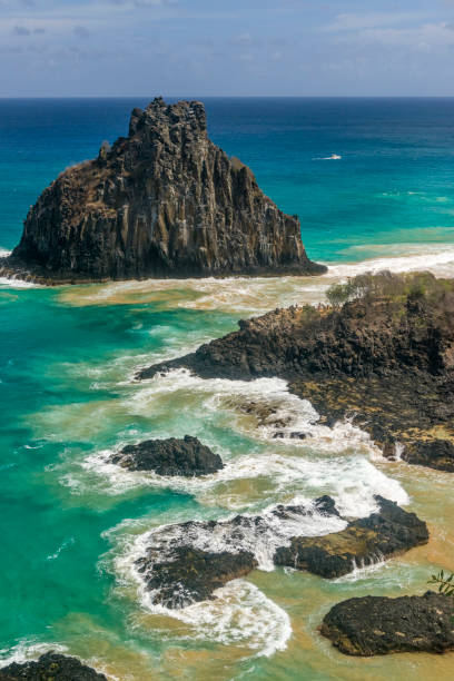 Fernando de Noronha Island, Porcos Bay Beach and Dois Irmaos Hills, Pernambuco, Brazil on December 16, 2021. Fernando de Noronha Island, Porcos Bay Beach and Dois Irmaos Hills, Pernambuco, Brazil on December 16, 2021. bay of pigs invasion stock pictures, royalty-free photos & images