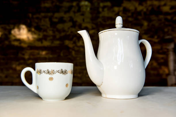 istock Antique porcelain coffee teapot and cup 1400514542