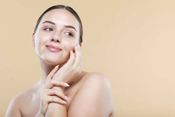 istock Happy beautiful woman holding her cheeks a laugh looking to the side. 1400515287