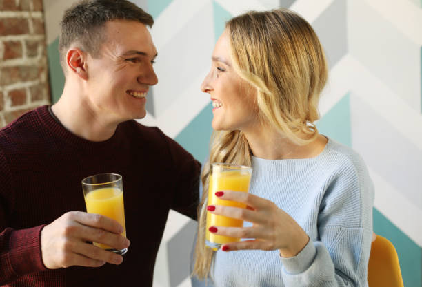 istock happy young couple having breakfast in the kitchen, morning for two, joy and hugs 1400515510