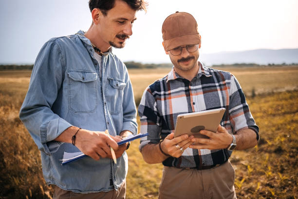 istock Two farmers in the field 1400515888