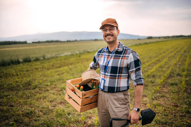 istock Proud farmer stands in a field 1400516994