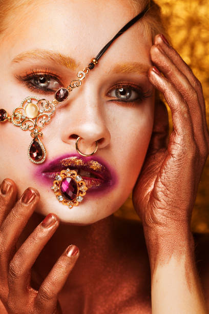 istock Beautiful young woman holding a precious ring in her mouth. 1400518942