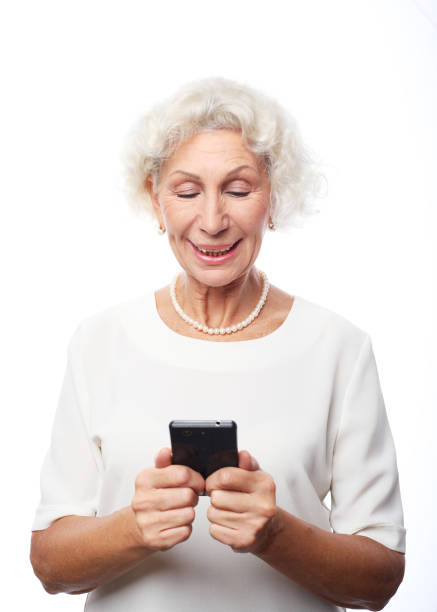 istock Old woman watching funny videos on internet. 1400519079