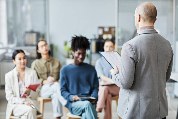 istock Coach Back View at Education Seminar in Office 1400519867