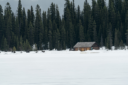 Secluded cabin on frozen Lake Louise, Banff National Park