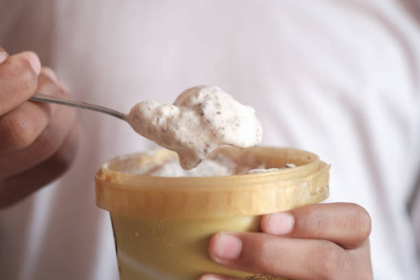 istock eating chocolate and vanila flavor ice cream in a container 1400527053