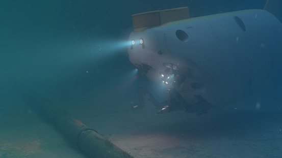 A deep sea submersible performing a pipeline inspection, 3D Rendered