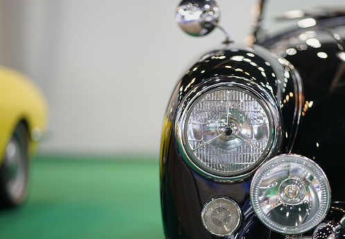 Circular car headlights in the old style (vintage style).