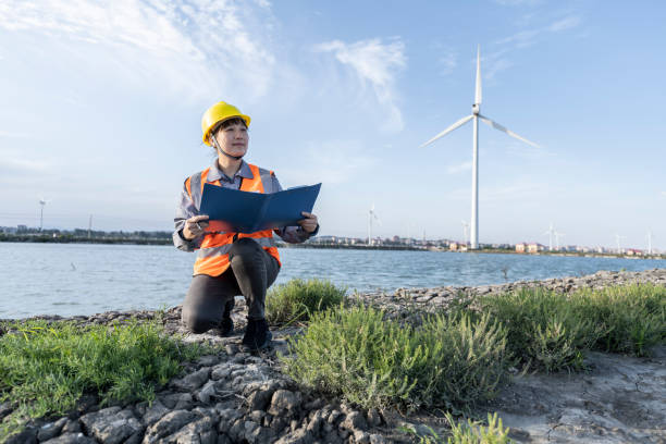 istock A female engineer works at a wind farm on the coast. 1400529106