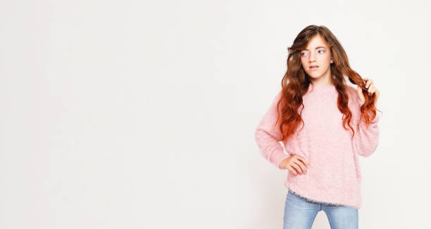 istock Cute curly little girl posing on a white background 1400530095