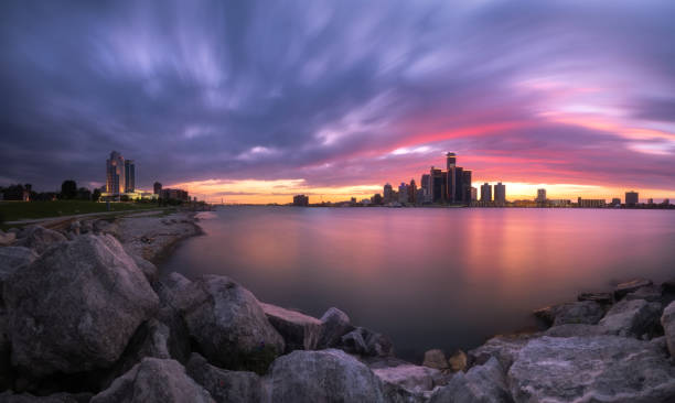 The Detroit and Windsor Skyline at Dusk The Detroit and Windsor Skylines at Dusk detroit michigan stock pictures, royalty-free photos & images