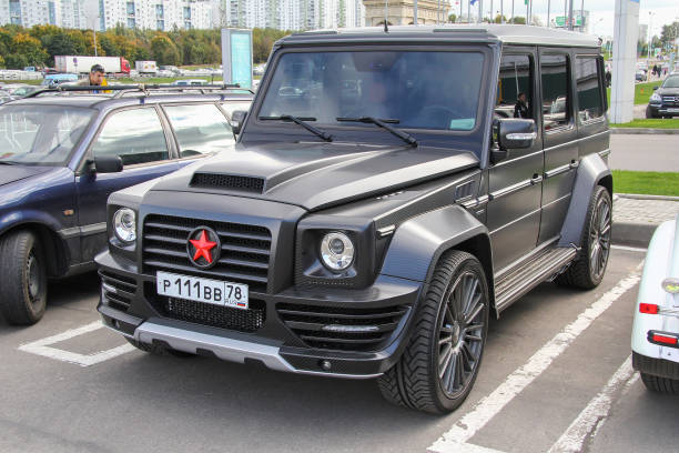 Mercedes-Benz G-class Moscow, Russia - September 29, 2012: Black luxury offroad car Mercedes-Benz G-class (W463) in a city street. g star stock pictures, royalty-free photos & images