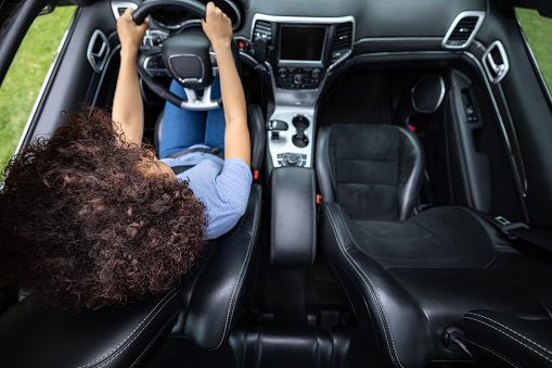 High Angle View of a woman driving an automatic car