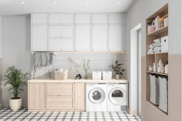 Modern Laundry Room With Washing Machine, Dryer And Cabinets