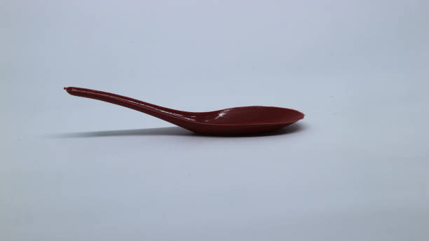 small blue red plastic spoon  fork on a white background stock photo