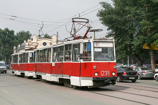 Chelyabinsk, Russia - July 2, 2008: Bright red Soviet tram 71-605 (KTM-5) in a city street.