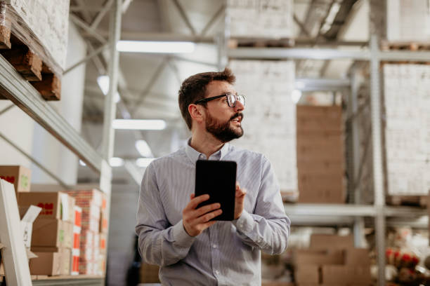 istock Warehouse manager doing his job in a factory 1400539838