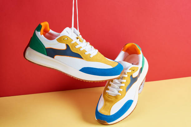 istock Stylish trendy shoes on colorful background 1400541000