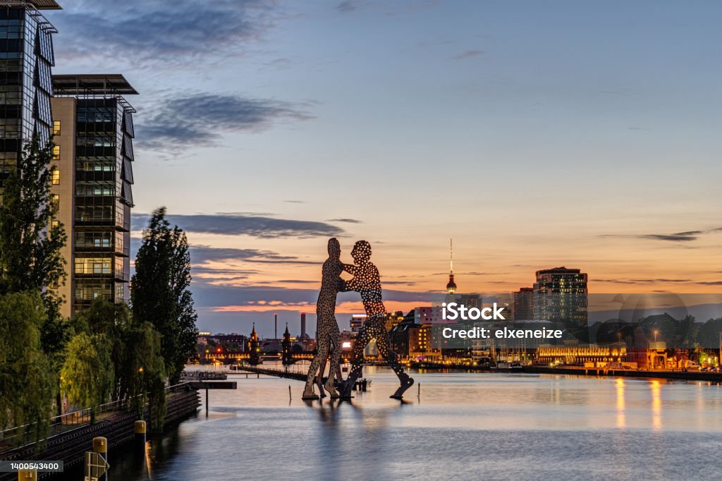 The river Spree in Berlin with the Molecule Men The river Spree in Berlin with the Molecule Men after sunset Berlin Stock Photo