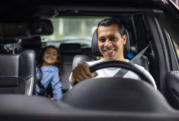 istock Happy father driving his daughter to school 1400543546
