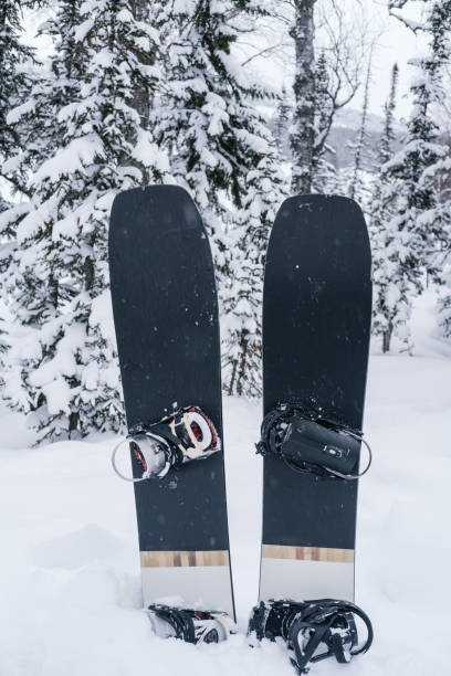 istock Two snowboards standing in snowdrift in snowy forest, nobody, vertical photo 1400544297