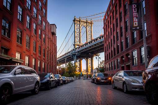 Iconic view of the Empire State Building and the Manhattan Bridge seen from Dumbo
