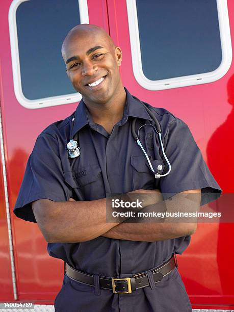 Portrait Of Paramedic In Front An Ambulance Stock Photo - Download Image Now - Paramedic, Emergency Services Occupation, Men