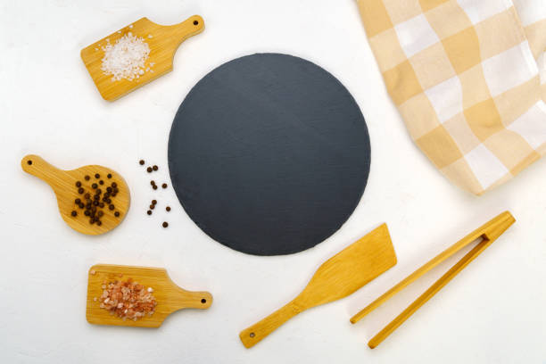 istock Black slate ingredients on a white concrete background. Copy the place for the text, recipe, restaurant menu 1400549702