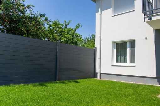 Modern privacy fence as garden or property boundaryModern high quality privacy fence
