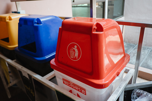 Garbage bins are classified into different types of waste by color.